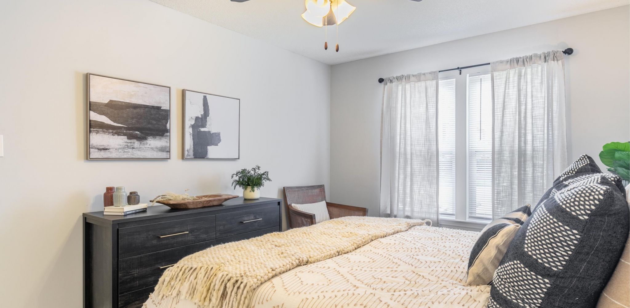 Hawthorne Commons spacious apartment bedroom with wood vinyl flooring and large windows